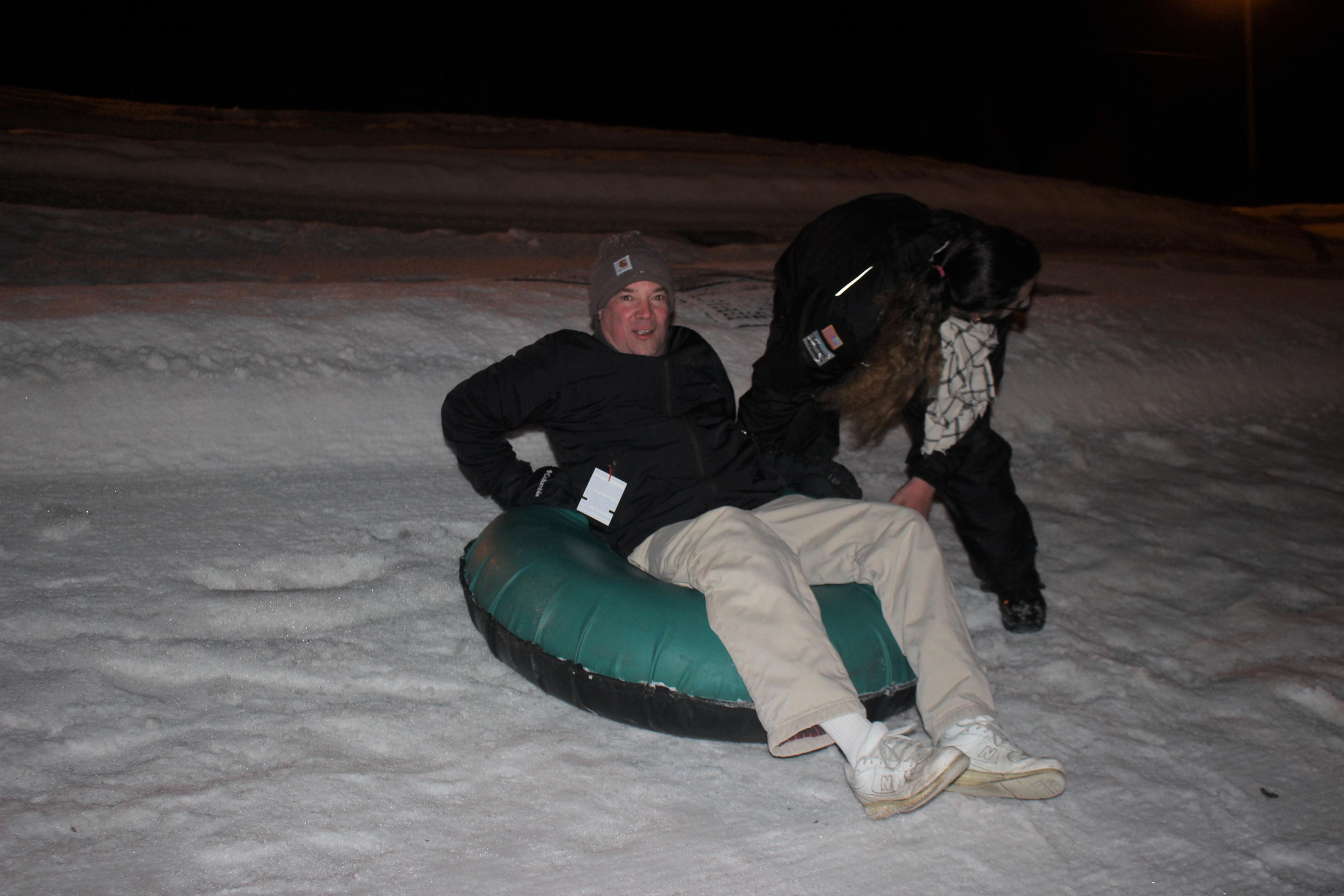 Staff member on a snow tube