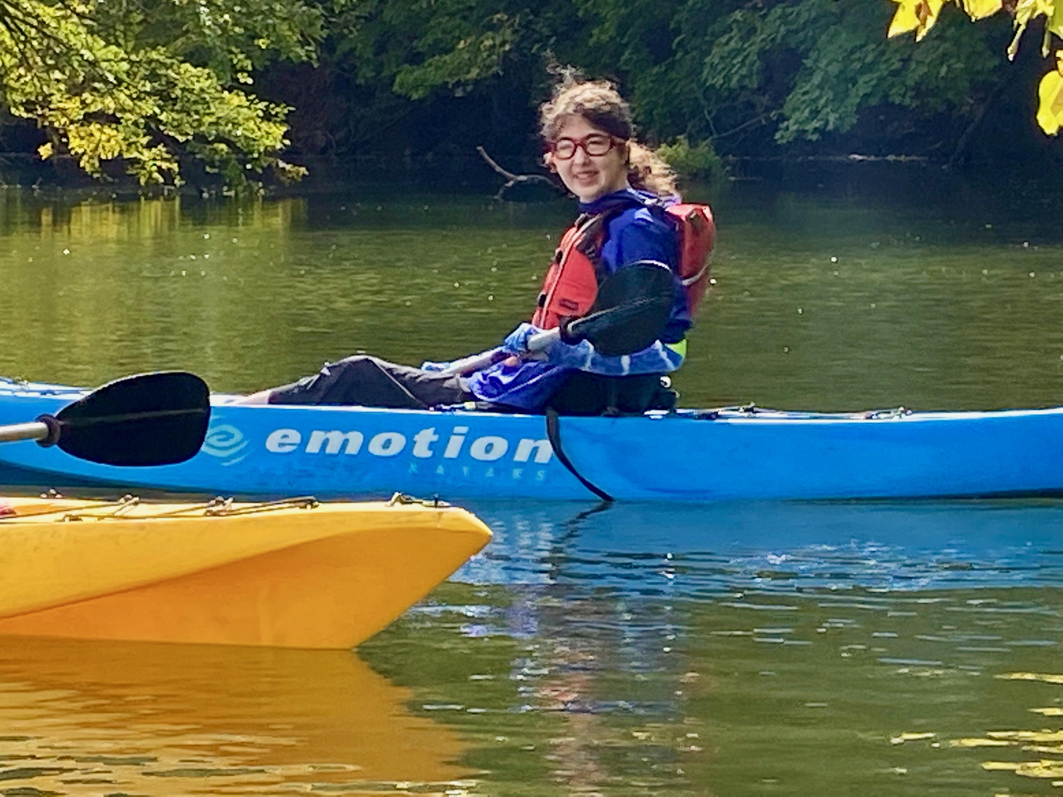 student kayaking