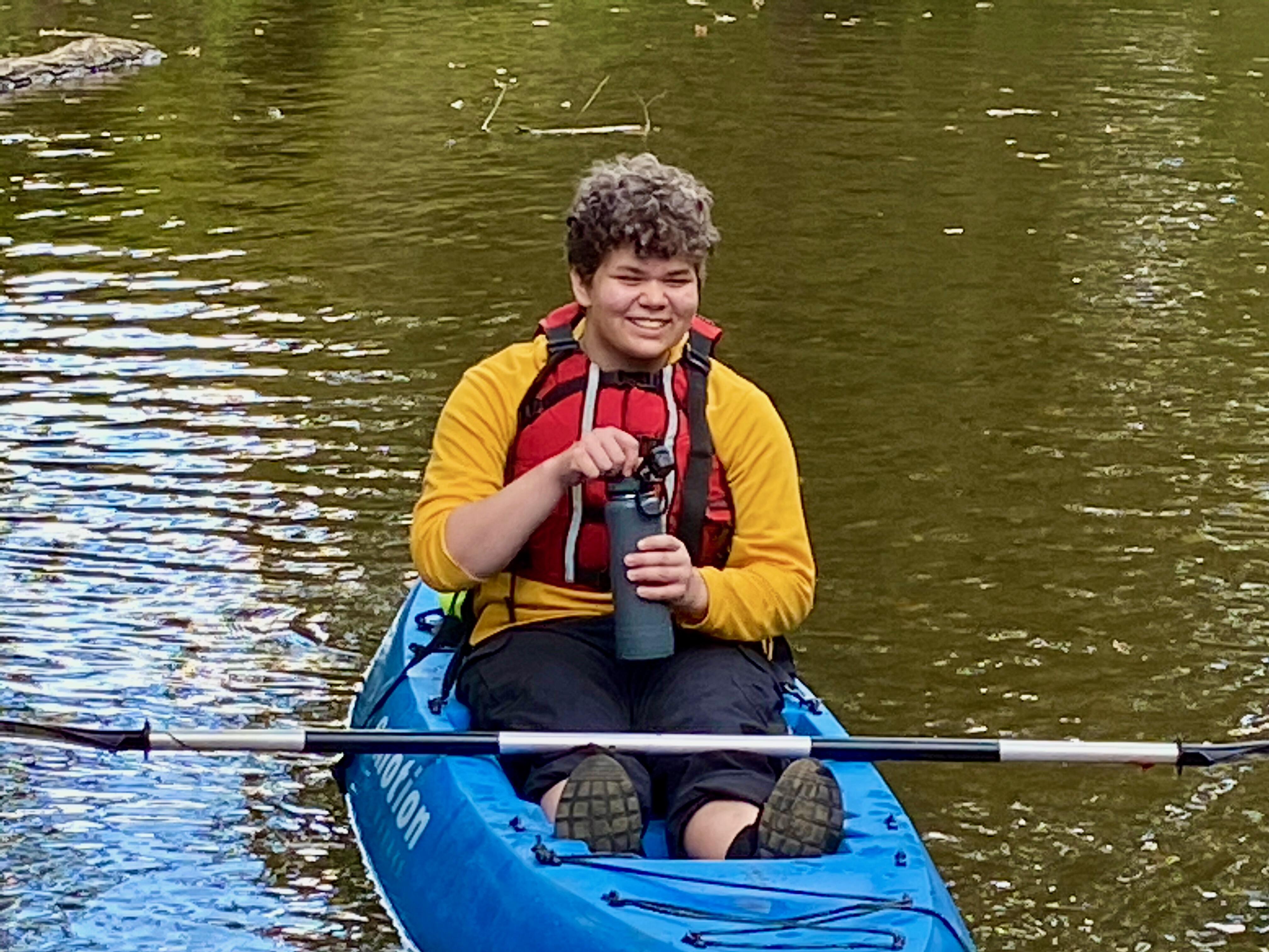 student in kayak