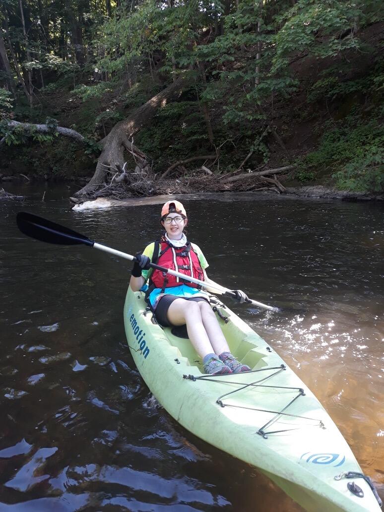 student in a kayak
