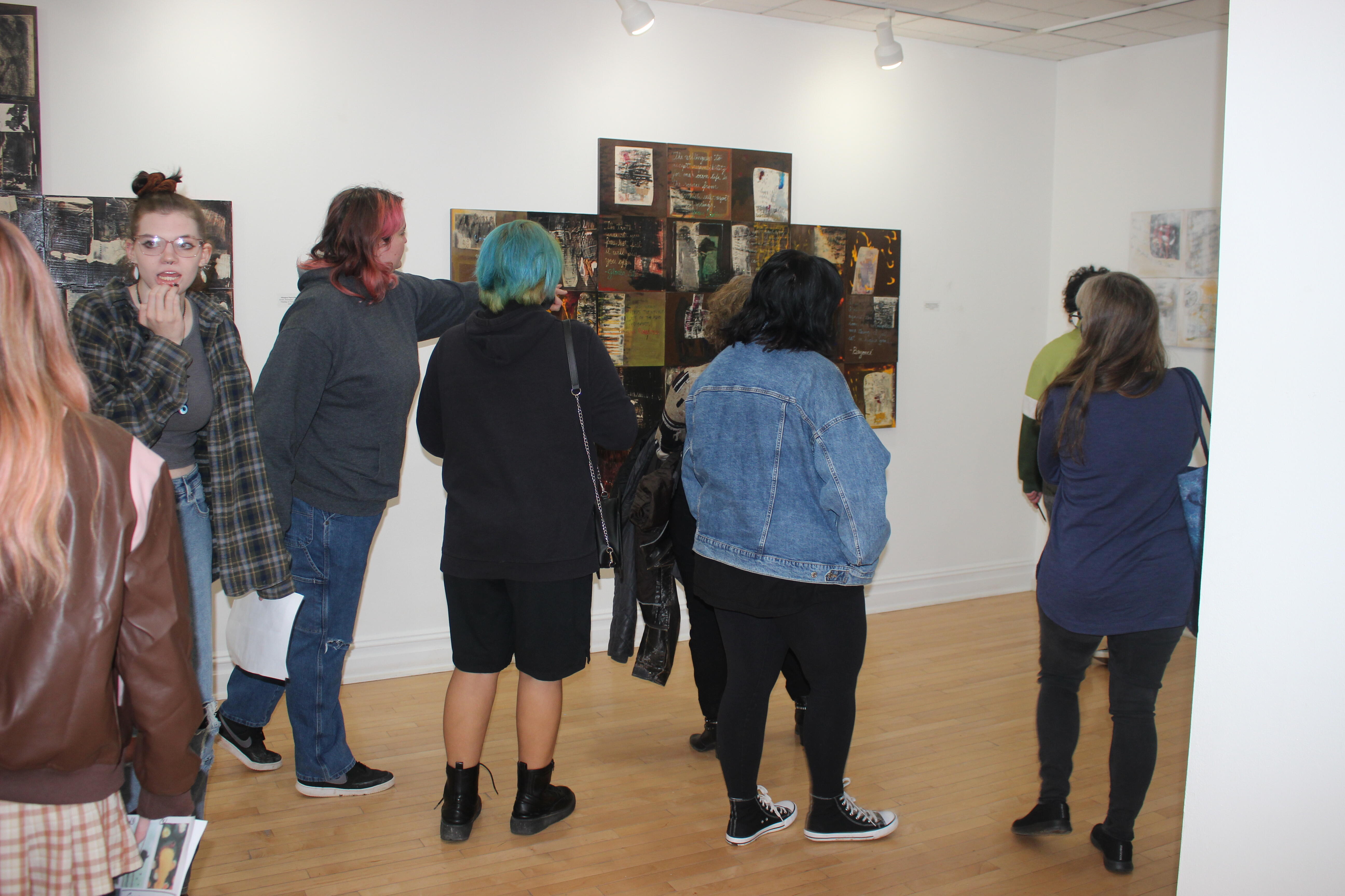 Group of students looking at art