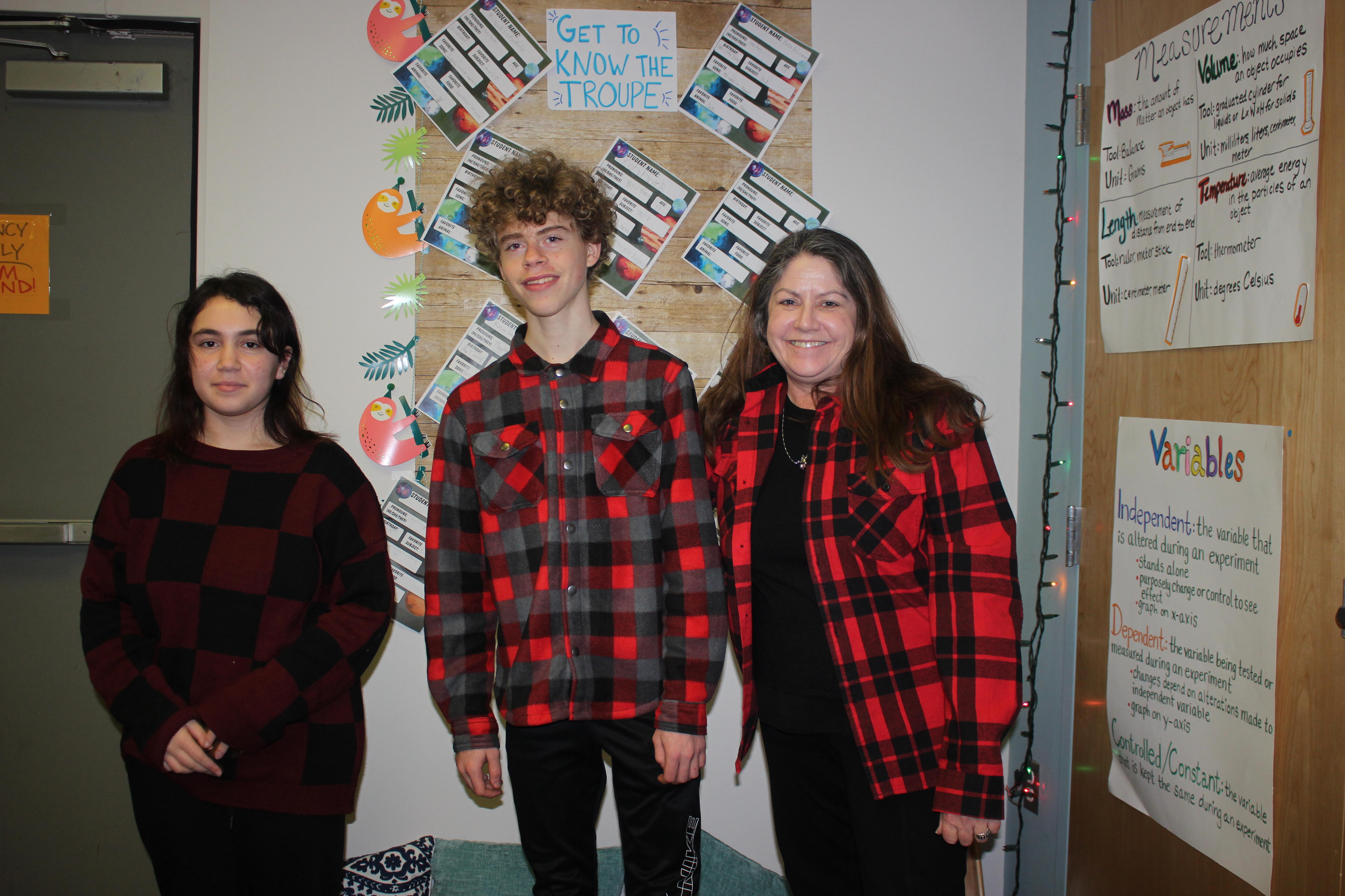 students and teacher wearing plaid shirts