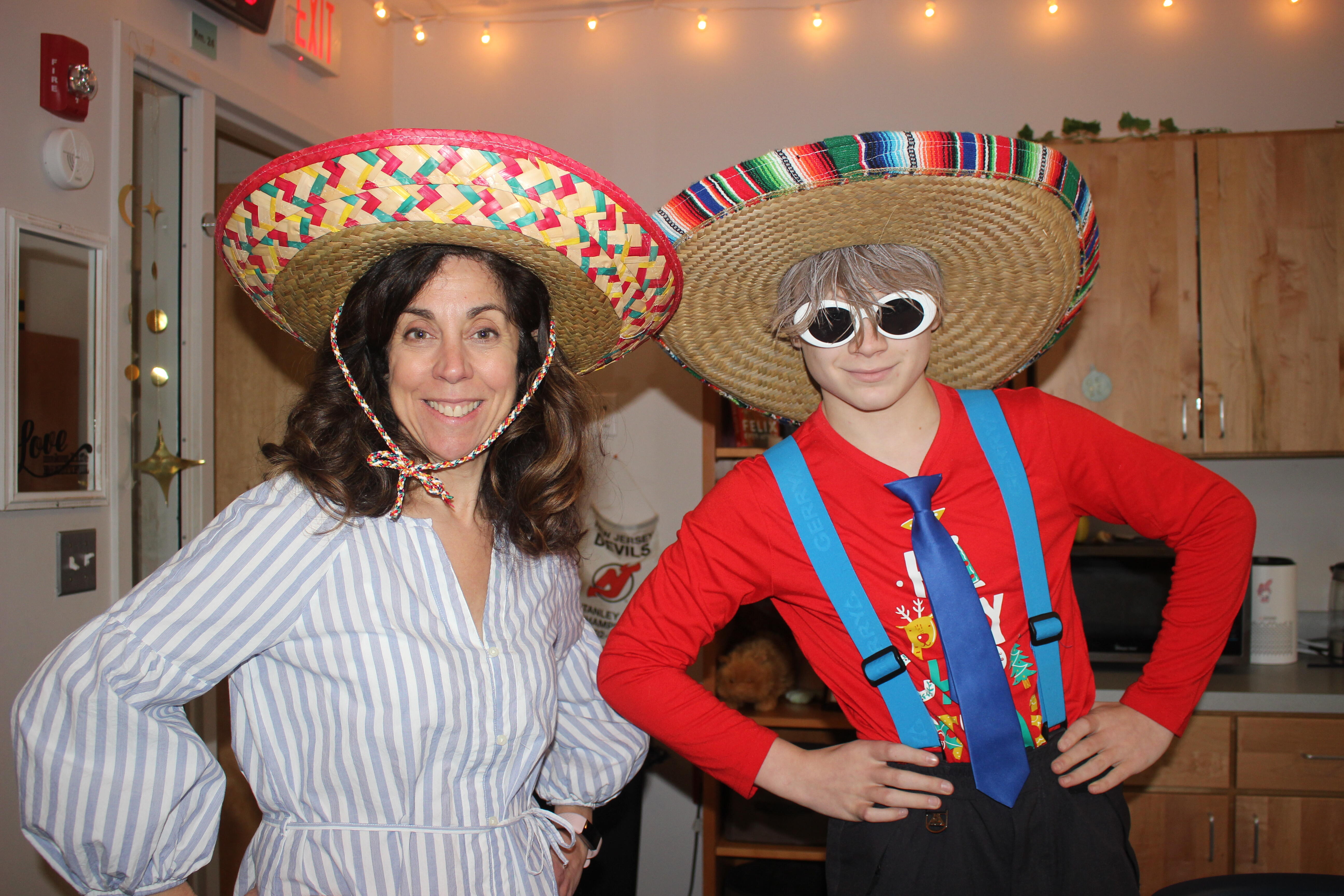 student and teacher wearing Mexican hats