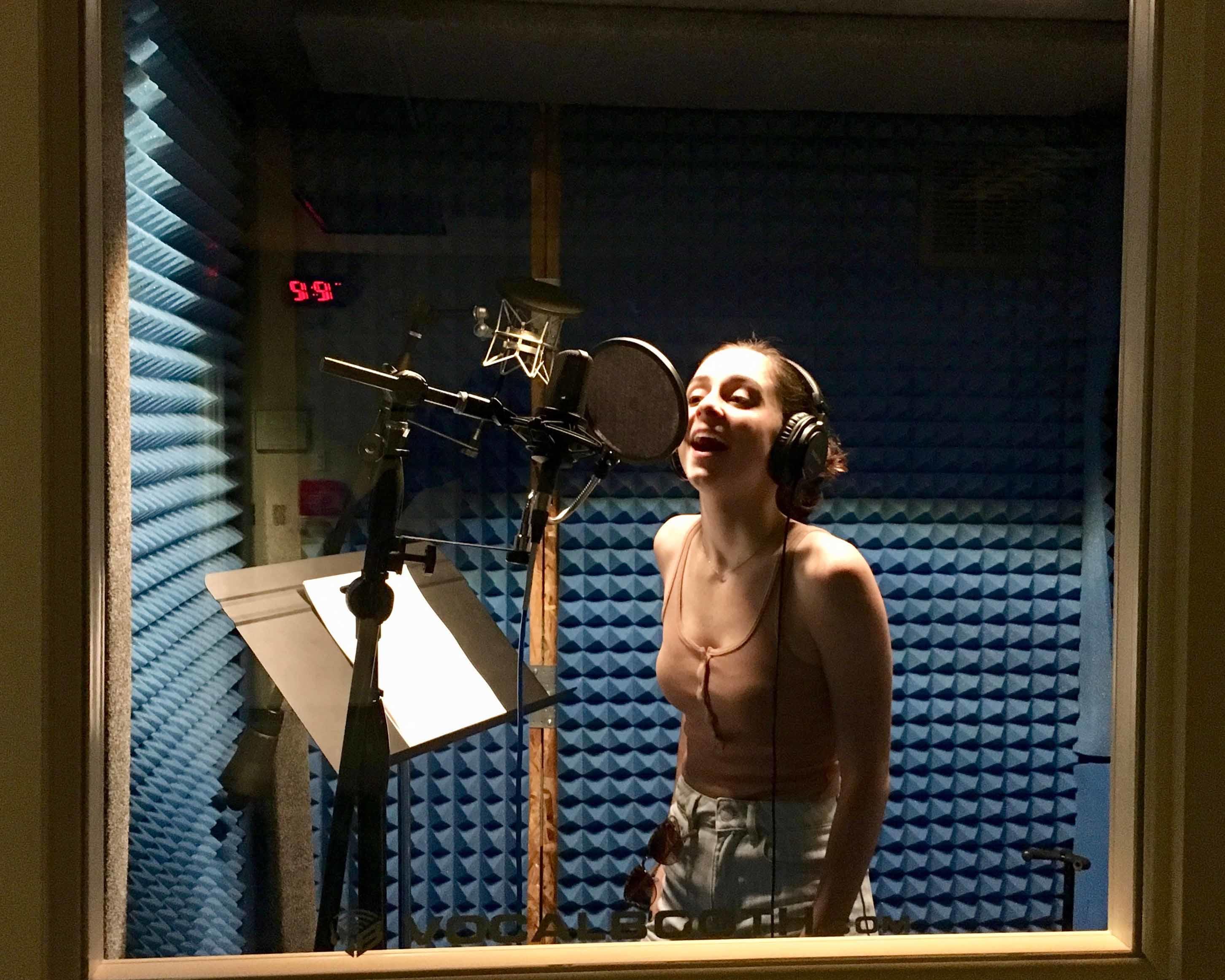 Student performing in the vocal booth